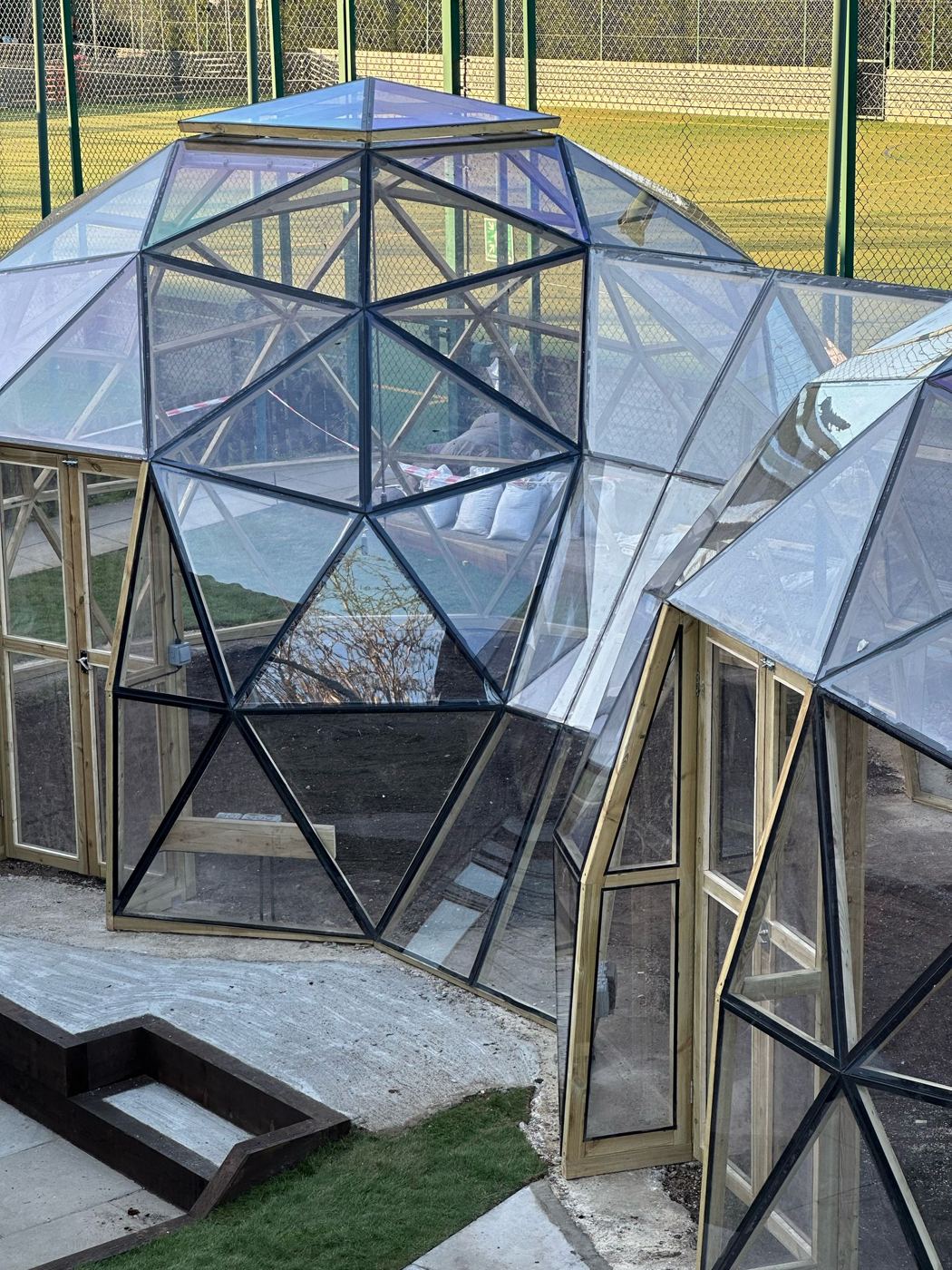 Twin linked glazed Wilder domes beside the courts at MKPS