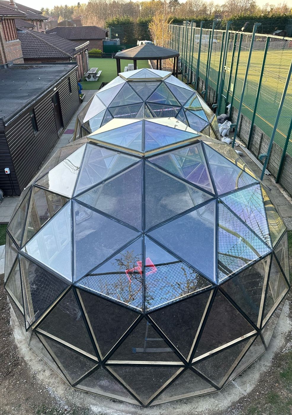 The dome pair from above, courts behind