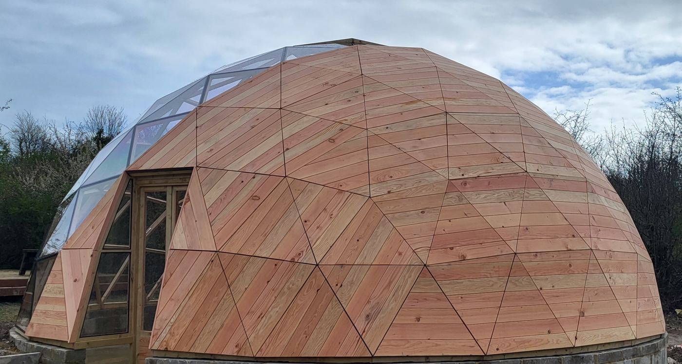 The timber geodesic frame during the build